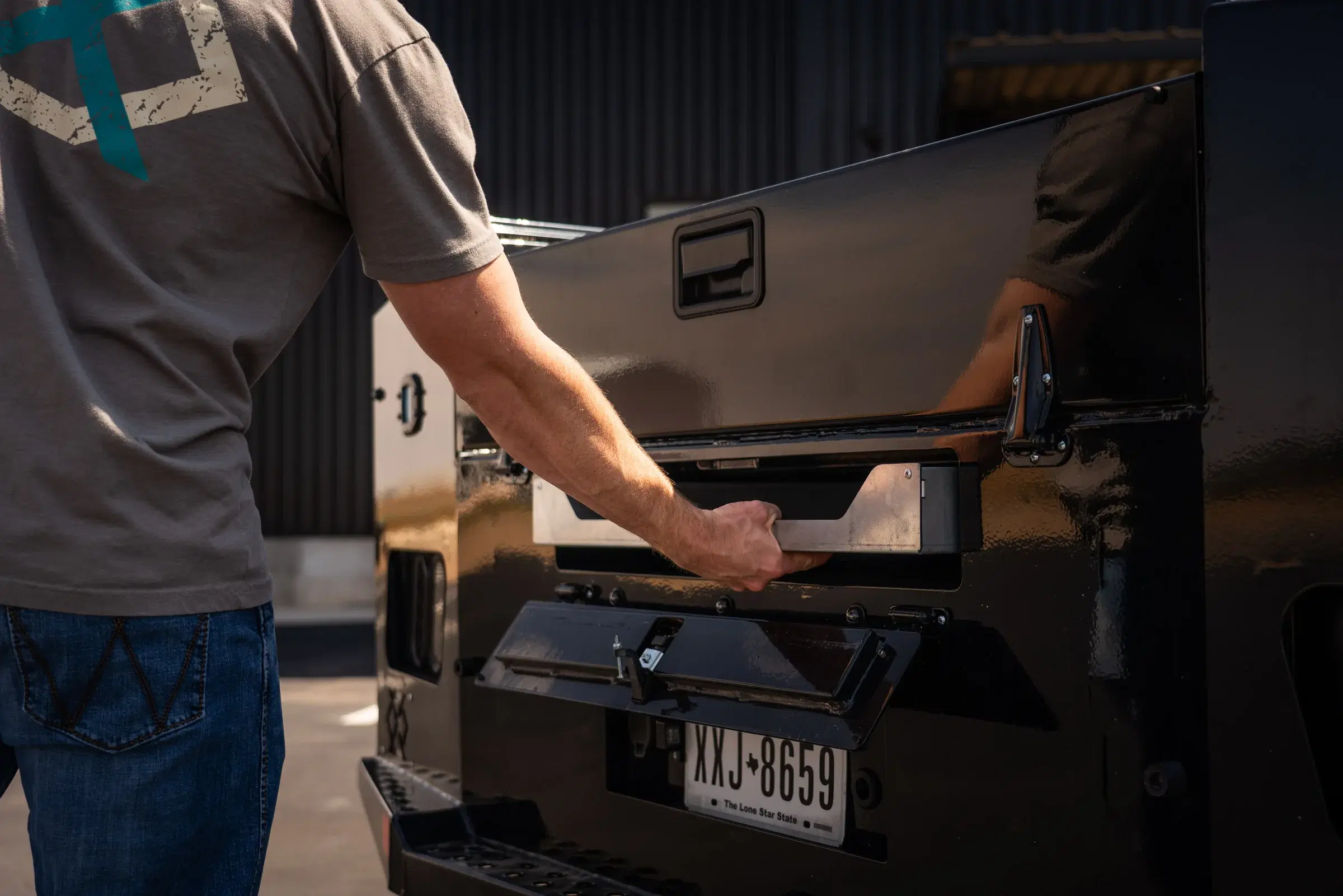 Belly box drawer pulled out through the rear access opening of a Legend X truck bed