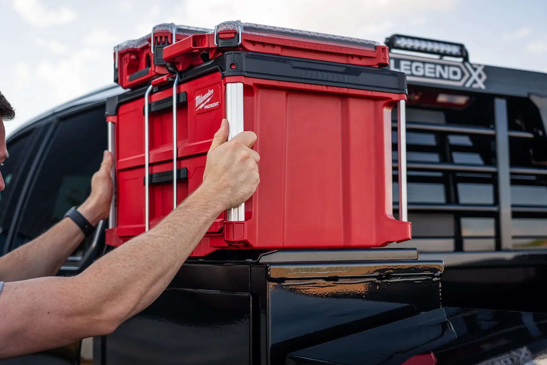 Milwaukee PACKOUT storage being mounted on a Legend X bracket on an Apollo bed