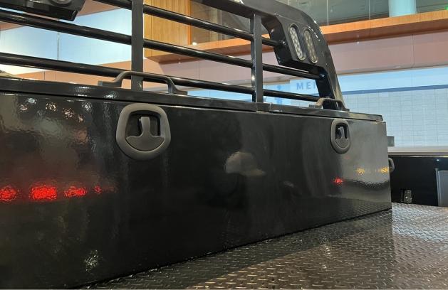 Bolted toolbox mounted at the front of a Legend X truck bed