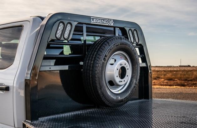Spare tire secured in a Legend X truck bed mount