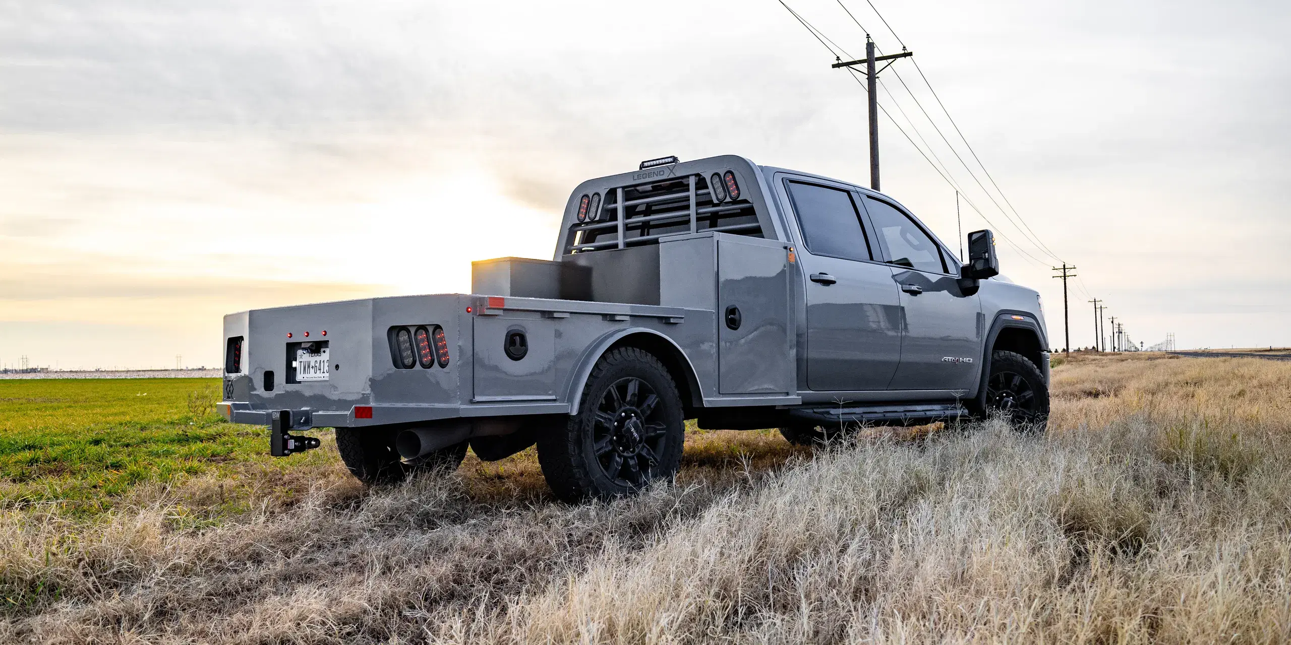 Color-matched Viking Pro on a GMC AT4 HD in a golden-hour field