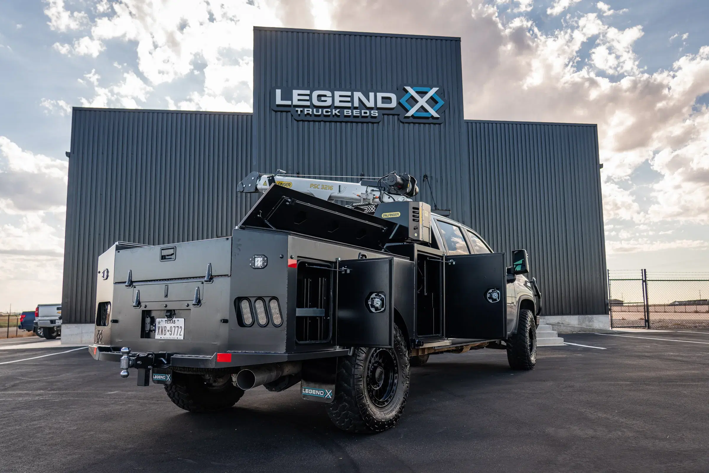 Rear skirt access door for the shovel-storage belly box on a Legend X truck bed